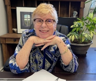 Anne at desk